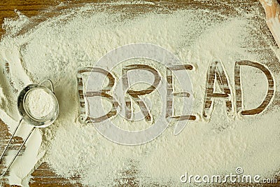 Flour with writted word BREAD Stock Photo