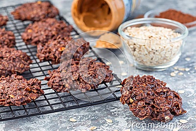 Flourless no bake peanut butter and oatmeal chocolate cookies on cooling rack, horizontal Stock Photo