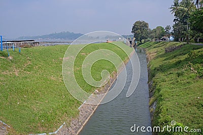 The flow of heavy river water that comes from the Rowo Jombor reservoir Stock Photo