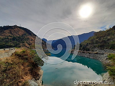 Flow of lake within the mountains chain blue and green water Stock Photo