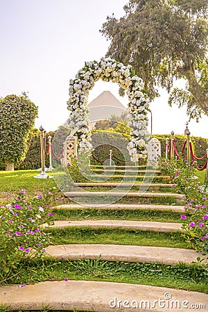 Flower arch as selfie spot with Cheops pyramid Editorial Stock Photo