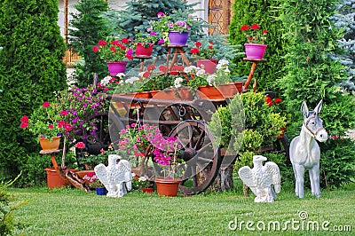 Flower arrangement in the garden of Monastery Bujoreni, landmark attraction in Romania. Spring landscape Stock Photo