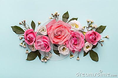 Flower arrangement of pink roses on blue background. Mothers day, Valentines Day, Birthday decor Stock Photo