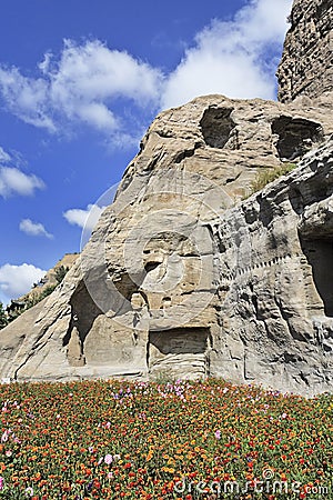 Flower bed near a rock formation, Yungang grottoes, Datong, China Stock Photo