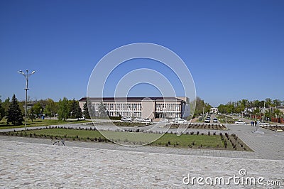 Flower beds near the house of culture near the central square in Oktyabrsky settlement. Editorial Stock Photo