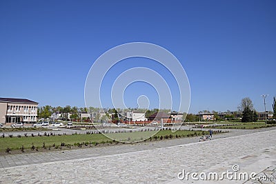 Flower beds near the house of culture near the central square in Oktyabrsky settlement. Editorial Stock Photo