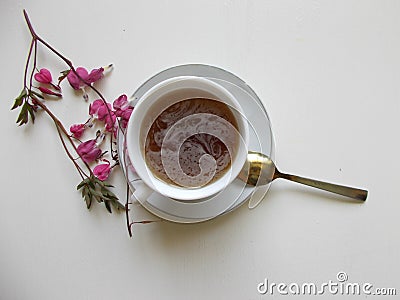 Tea in a white Cup, with pink flowers Stock Photo