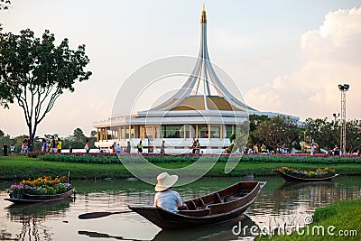 Flower boat and boat with man in Suan Luang Rama IX Flowers Festival Editorial Stock Photo