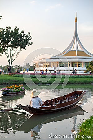 Flower boat and boat with man in Suan Luang Rama IX Flowers Festival Editorial Stock Photo