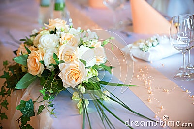 Flower bouquet on wedding dining table Stock Photo