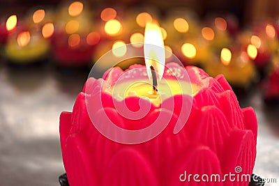 Flower candles burning at night. Stock Photo