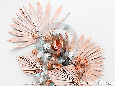 Flower composition made of dried palm leaves and exotic protea on pastel grey background. Nature tropical concept, copy space, Stock Photo