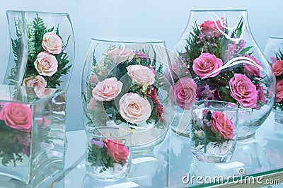 Flower compositions of roses in vacuum glass Stock Photo