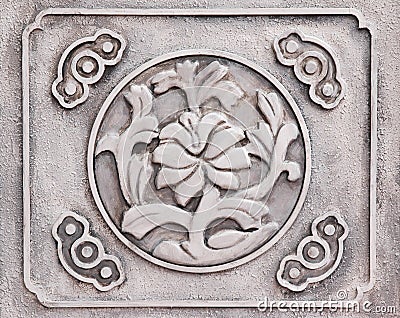 Flower engraved on stone Stock Photo