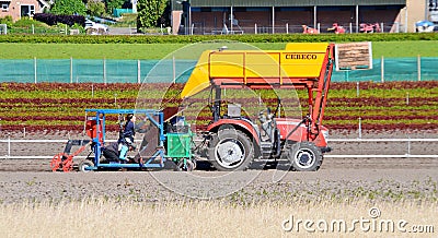 Bulb Planters behind a driverless tractor Editorial Stock Photo