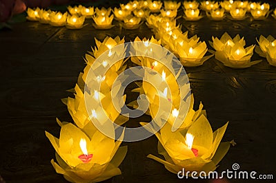 Flower garlands and colored lanterns for celebrating Buddha`s birthday in Eastern culture. They are made from cut paper and candl Stock Photo