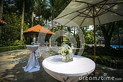 Flower High foot table set sunshine outdoor decoration Stock Photo