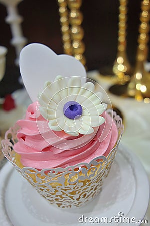 Flower and loving heart cupcake Stock Photo