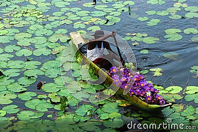 Flower seller in a boat Editorial Stock Photo