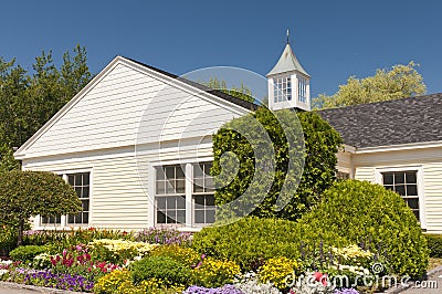 Flowerbed around building Stock Photo