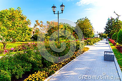 Flowerbeds, Grass Pathway and Ornamental Vase in a Formal Garden Stock Photo