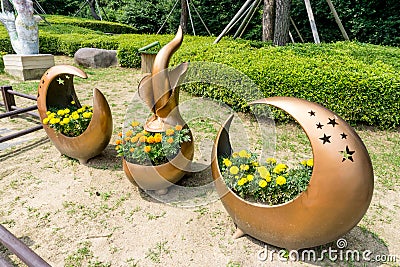 Flowerpot made from copper alloy display in the public park in Haeundae Dongbaekseom Island Editorial Stock Photo