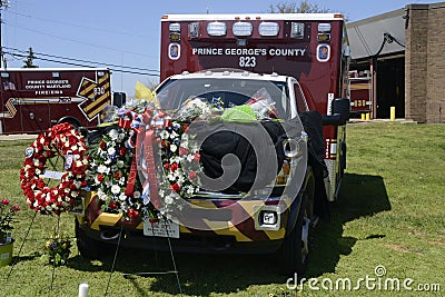 Flowers adorn an ambulance to mourn a medic was shot and killed Editorial Stock Photo