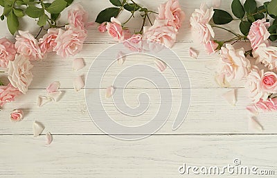 Flowers background. Bouquet of beautiful pink roses on white wooden background. Stock Photo