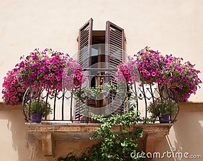 Flowers on a balcony in Pienza Tuscany Stock Photo