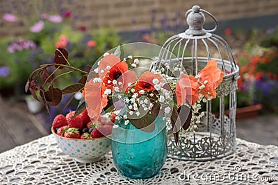 Flowers and berries outdoor table decor Stock Photo