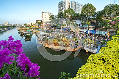 Flowers boat at flower market along canal wharf Editorial Stock Photo