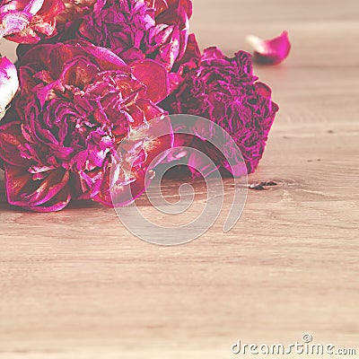 Flowers. A bouquet of lilac peonies lies on a wooden background Stock Photo