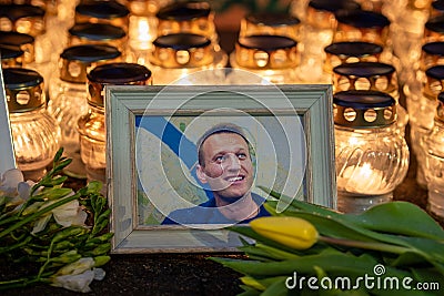 Flowers and candles laid at spontaneous memorial for Russian opposition leader Alexei Navalny Editorial Stock Photo