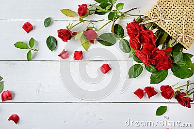 Flowers composition. Red roses on a white wooden background. Fla Stock Photo