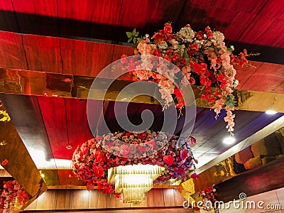 Flowers decoration inside indian wedding banquet hall during evening time in Delhi India Stock Photo