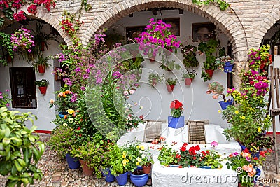 Flowers Decoration of Vintage Courtyard, typical house in Cordoba, Spain Editorial Stock Photo