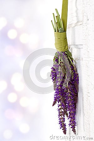 Flowers hanging on a vintage door Stock Photo