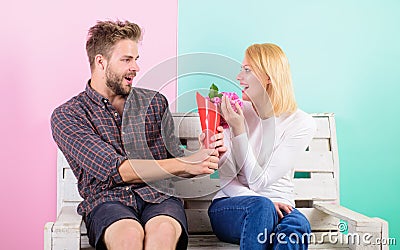 Flowers for her. Man gives bouquet flowers to girlfriend. He guessed her favorite flower. Pleasant surprise for lady Stock Photo