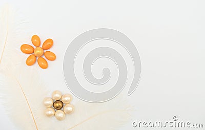 Flowers made of chocolate beads with feathers on white background. Mother day, Valentine day, Wedding, Birthday, Easter or other Stock Photo