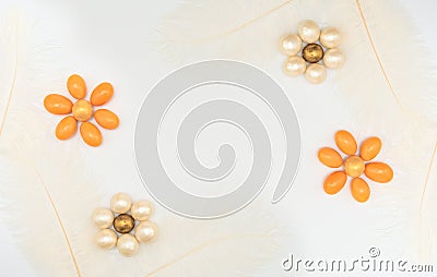 Flowers made of chocolate beads with feathers on white background. Mother day, Valentine day, Wedding, Birthday, Easter or other Stock Photo