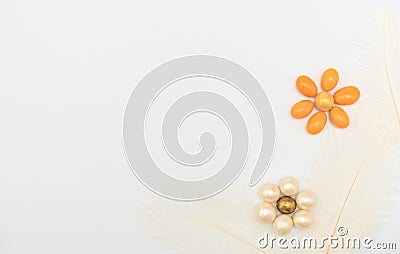 Flowers made of chocolate beads with feathers on white background. Mother day, Valentine day, Wedding, Birthday or other suitable Stock Photo