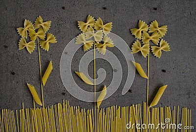 Flowers made of dry pasta. Stock Photo