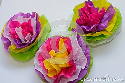 Three colorful tissue paper flowers Stock Photo