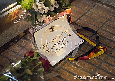 Flowers and message in memory of victims of terrorist attacks in Brussels at Belgium embassy in Madrid, Spain Editorial Stock Photo