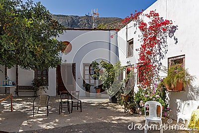 Flowers in Panagia Episkopi Church in Santorini island, Thira, Greece Stock Photo