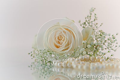 Flowers and pearls on white background Stock Photo