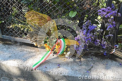 Flowers at the place where Benito Mussolini was killed Editorial Stock Photo