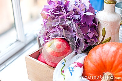 Flowers and pumpkin for autumn home decor. Beautiful composition Stock Photo