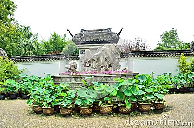 Flowers, rocks, ancient architecture Stock Photo