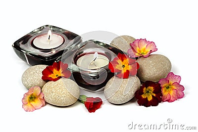 Flowers, stones and scented candles Stock Photo